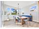Bright dining room features a stylish table, chairs, and views of the landscaped outdoors at 13383 Vickery Ridge Dr, Fishers, IN 46037