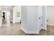 Open hallway featuring a view of the upstairs staircase and a bathroom with an open door and light floors at 13383 Vickery Ridge Dr, Fishers, IN 46037