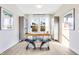 Inviting home office with natural light, a simple desk, and minimalistic decor at 13383 Vickery Ridge Dr, Fishers, IN 46037