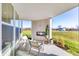 Inviting covered patio with a fireplace, seating, and views of the outdoors at 13383 Vickery Ridge Dr, Fishers, IN 46037