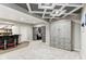 Basement features a large finished space with bar, Murphy bed, and sliding barn doors to bonus room at 14466 Integrity Ct, Carmel, IN 46033