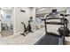 Finished basement features a full bathroom plus a workout area with treadmill, stationary bike, and weights at 14466 Integrity Ct, Carmel, IN 46033