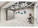 Finished basement showing neutral paint, carpeted floors and large Murphy bed, coffered ceiling, recessed lights at 14466 Integrity Ct, Carmel, IN 46033