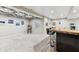 Finished basement offers a custom bar, modern flooring and unique coffered ceiling detail at 14466 Integrity Ct, Carmel, IN 46033