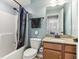 Full bathroom with a shower-tub combo, toilet, vanity, and blue walls at 14466 Integrity Ct, Carmel, IN 46033