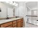 Upstairs bathroom features double sink granite vanity, large mirror and access to the hall at 14466 Integrity Ct, Carmel, IN 46033