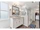 Bathroom with granite counters, undermount sink, gray tile, sliding glass door shower, and modern lighting at 14466 Integrity Ct, Carmel, IN 46033