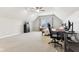 Bright bedroom featuring vaulted ceilings, a ceiling fan, a bed, and a window seat at 14466 Integrity Ct, Carmel, IN 46033