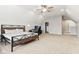 Bright bedroom with a ceiling fan, a bed, an ensuite, and a closet at 14466 Integrity Ct, Carmel, IN 46033