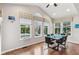 Bright dining room with hardwood floors, a high ceiling and lots of windows overlooking a beautiful backyard at 14466 Integrity Ct, Carmel, IN 46033