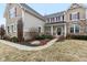 An inviting exterior view showcasing the well-maintained landscaping and architectural details of the home at 14466 Integrity Ct, Carmel, IN 46033