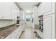 Large laundry room with a sink, washer, dryer, ample storage, and bench at 14466 Integrity Ct, Carmel, IN 46033