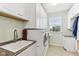Laundry room with a sink, washer, dryer, and cabinets at 14466 Integrity Ct, Carmel, IN 46033