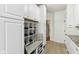 Well-organized mudroom with custom built-in storage, a bench, and cubbies for shoes and personal items at 14466 Integrity Ct, Carmel, IN 46033