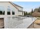 Luxurious outdoor kitchen featuring granite countertops, a firepit, and seating area at 14466 Integrity Ct, Carmel, IN 46033