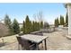 Outdoor patio featuring an outdoor kitchen with a built-in grill and a spacious dining area for entertaining at 14466 Integrity Ct, Carmel, IN 46033