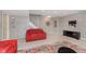 Basement with gray walls, red sofa, carpeted floors, and a white staircase at 1457 Dominion Dr, Zionsville, IN 46077