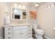 Bright bathroom featuring a white vanity, grey floors and a colorful art piece at 1457 Dominion Dr, Zionsville, IN 46077