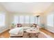 Bright living room with large windows, neutral tones, and comfortable seating at 1457 Dominion Dr, Zionsville, IN 46077