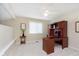 Bright office space with hardwood desk, ceiling fan, and natural light at 1457 Dominion Dr, Zionsville, IN 46077