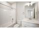 Bright bathroom with a tub/shower combination and white vanity with solid countertop at 15871 Vitalize Run, Fishers, IN 46040