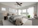 Bright bedroom featuring a ceiling fan, large windows, and stylish furniture at 15871 Vitalize Run, Fishers, IN 46040