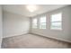 Bedroom featuring three windows, neutral walls, carpet and plenty of natural light at 15871 Vitalize Run, Fishers, IN 46040