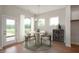 Chic dining area with modern chandelier and a decorative wooden cabinet by the entryway at 15871 Vitalize Run, Fishers, IN 46040
