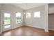 Bright dining area with modern chandelier lighting and glass doors to the backyard at 15871 Vitalize Run, Fishers, IN 46040