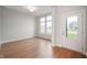 Welcoming entryway with hardwood floors, natural light, and view to exterior of the home at 15871 Vitalize Run, Fishers, IN 46040