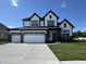 Stunning two-story home with a three car garage and manicured lawn at 15871 Vitalize Run, Fishers, IN 46040