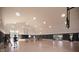 Spacious indoor gymnasium with basketball court, high ceilings, and ample lighting for various recreational activities at 15871 Vitalize Run, Fishers, IN 46040