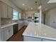 Modern kitchen with large island, sleek countertops, and stainless steel appliances at 15871 Vitalize Run, Fishers, IN 46040