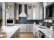 Modern kitchen featuring gray cabinets, stainless steel appliances, and a blue tile backsplash at 15871 Vitalize Run, Fishers, IN 46040