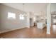 Modern kitchen with stainless steel appliances and a large island, next to a dining space at 15871 Vitalize Run, Fishers, IN 46040