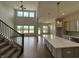 Open-concept living area with soaring ceilings and large windows, perfect for entertaining at 15871 Vitalize Run, Fishers, IN 46040