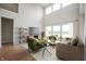 Cozy living room with modern furniture, hardwood floors, high ceilings, and natural light at 15871 Vitalize Run, Fishers, IN 46040