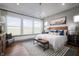 Serene bedroom with large windows, a comfortable bed, and stylish furnishings at 15871 Vitalize Run, Fishers, IN 46040