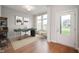 Bright home office with hardwood floors, stylish decor, desk, chair, and natural light at 15871 Vitalize Run, Fishers, IN 46040