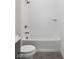 Bathroom with a tiled shower and tub with brushed gold fixtures at 17364 Pinellas Ave, Westfield, IN 46074