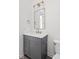 Stylish bathroom with a gray vanity, white countertop, and brushed gold hardware and lighting at 17364 Pinellas Ave, Westfield, IN 46074