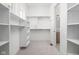 Spacious walk-in closet with ample shelving and rods for organization, next to a well-appointed bathroom at 17364 Pinellas Ave, Westfield, IN 46074