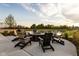 Relaxing outdoor firepit area with Adirondack chairs and a view of the pond for community residents at 17364 Pinellas Ave, Westfield, IN 46074