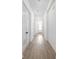 Bright hallway with hardwood floors leading to a front door and featuring elegant French doors at 17364 Pinellas Ave, Westfield, IN 46074