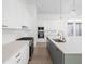 Open-concept kitchen with stainless steel appliances, a large island, and modern finishes at 17364 Pinellas Ave, Westfield, IN 46074