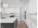 Bright kitchen featuring white cabinets, stone countertops, and stainless steel appliances at 17364 Pinellas Ave, Westfield, IN 46074