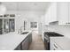 Modern kitchen with stainless steel appliances, large countertops, and hardwood flooring at 17364 Pinellas Ave, Westfield, IN 46074