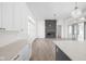 Open floor plan with fireplace, modern lighting, and access to the modern kitchen at 17364 Pinellas Ave, Westfield, IN 46074