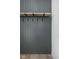 A stylish mudroom with a shelf, hooks, and grey wood paneling at 17364 Pinellas Ave, Westfield, IN 46074