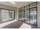 Bright enclosed patio with black-framed sliding doors and multiple windows that bring in natural light to a comfortable space at 17364 Pinellas Ave, Westfield, IN 46074